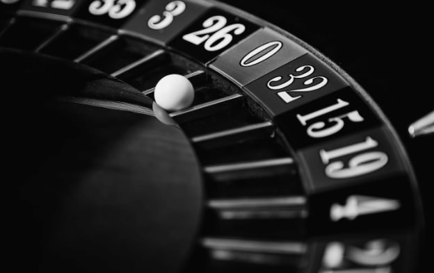 Dealer revealing hole card in live play